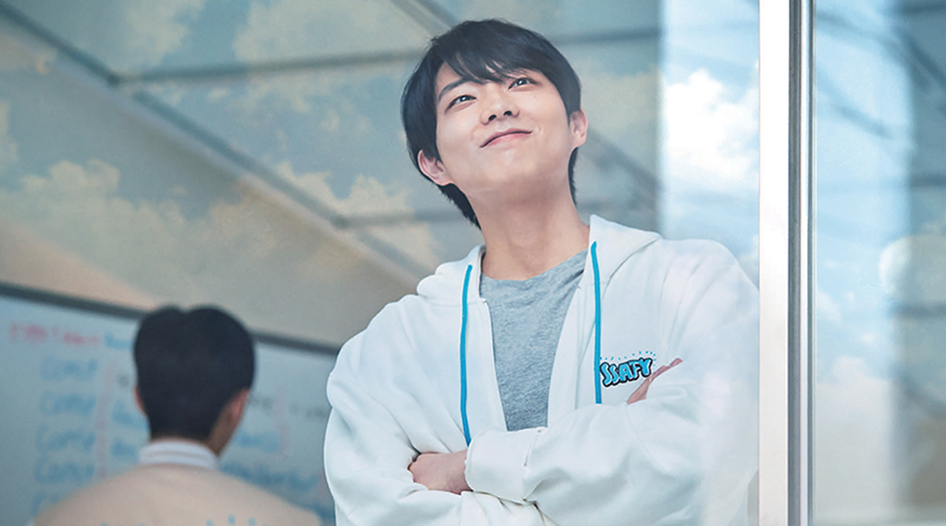 A young man wearing a hoodie featuring the Samsung Software and AI Academy for Youth logo.